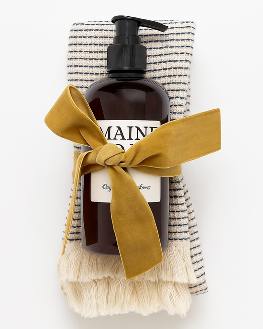 Brown bottle with pump and yellow ribbon on a white background