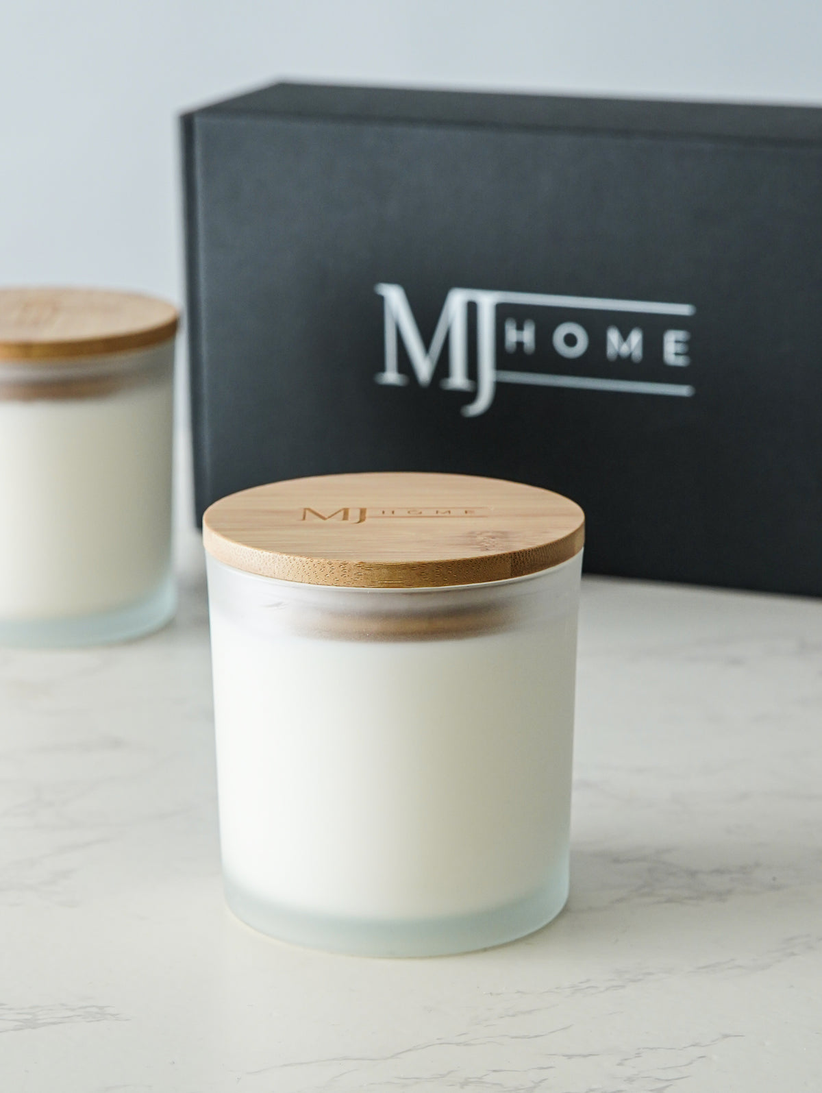 MJHome double wick soy apothecary candle in frosted glass jar with natural bamboo lid and black MJHome gift box