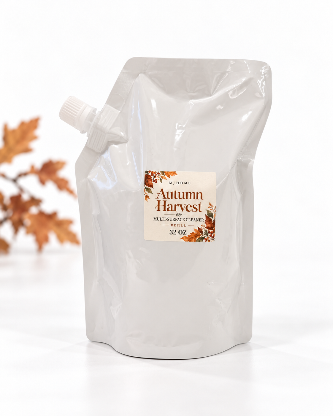 MJHome Autumn Harvest 32 oz cleaner refill on a clean white background with subtle autumn leaves