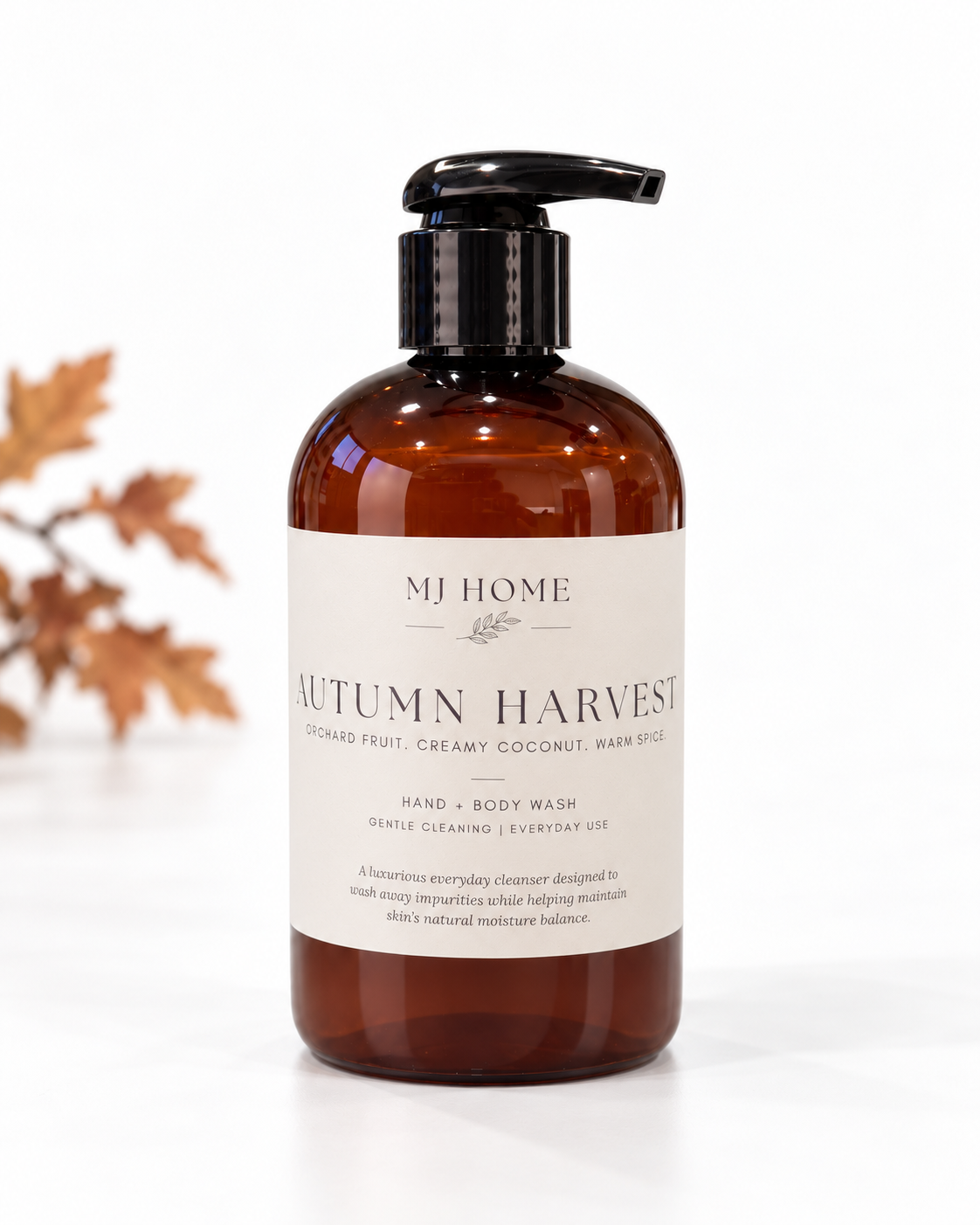 MJHome Autumn Harvest hand and body wash on a clean white background with subtle autumn leaves